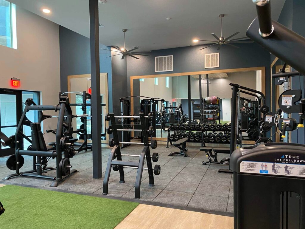 A condo gym featuring Ecore gym flooring. 