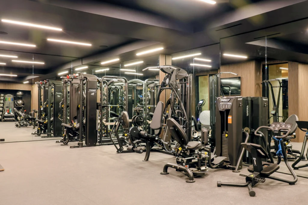 Luxury home gym with premium strength machines and mirrored walls