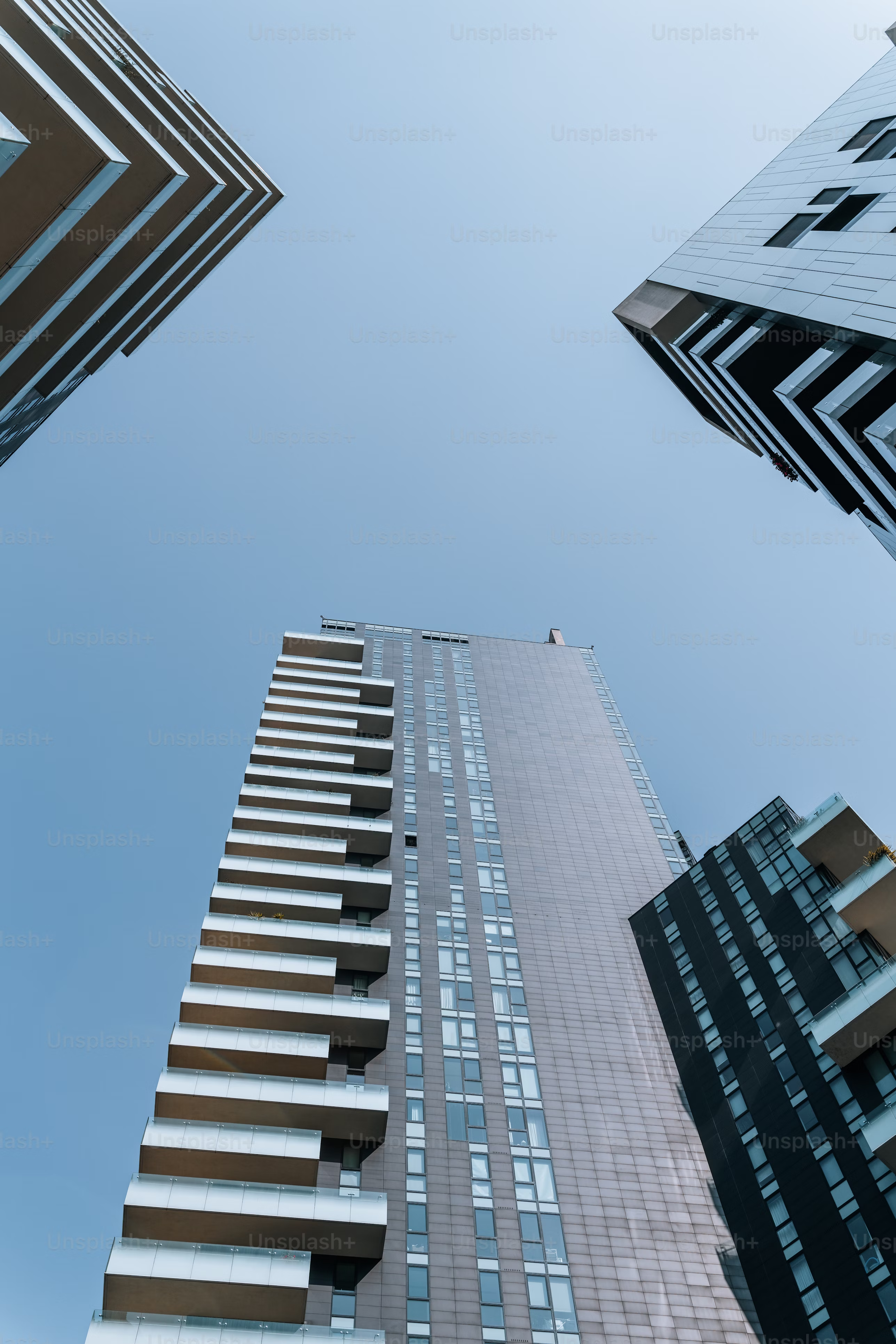 Modern high-rise apartment building viewed from below
